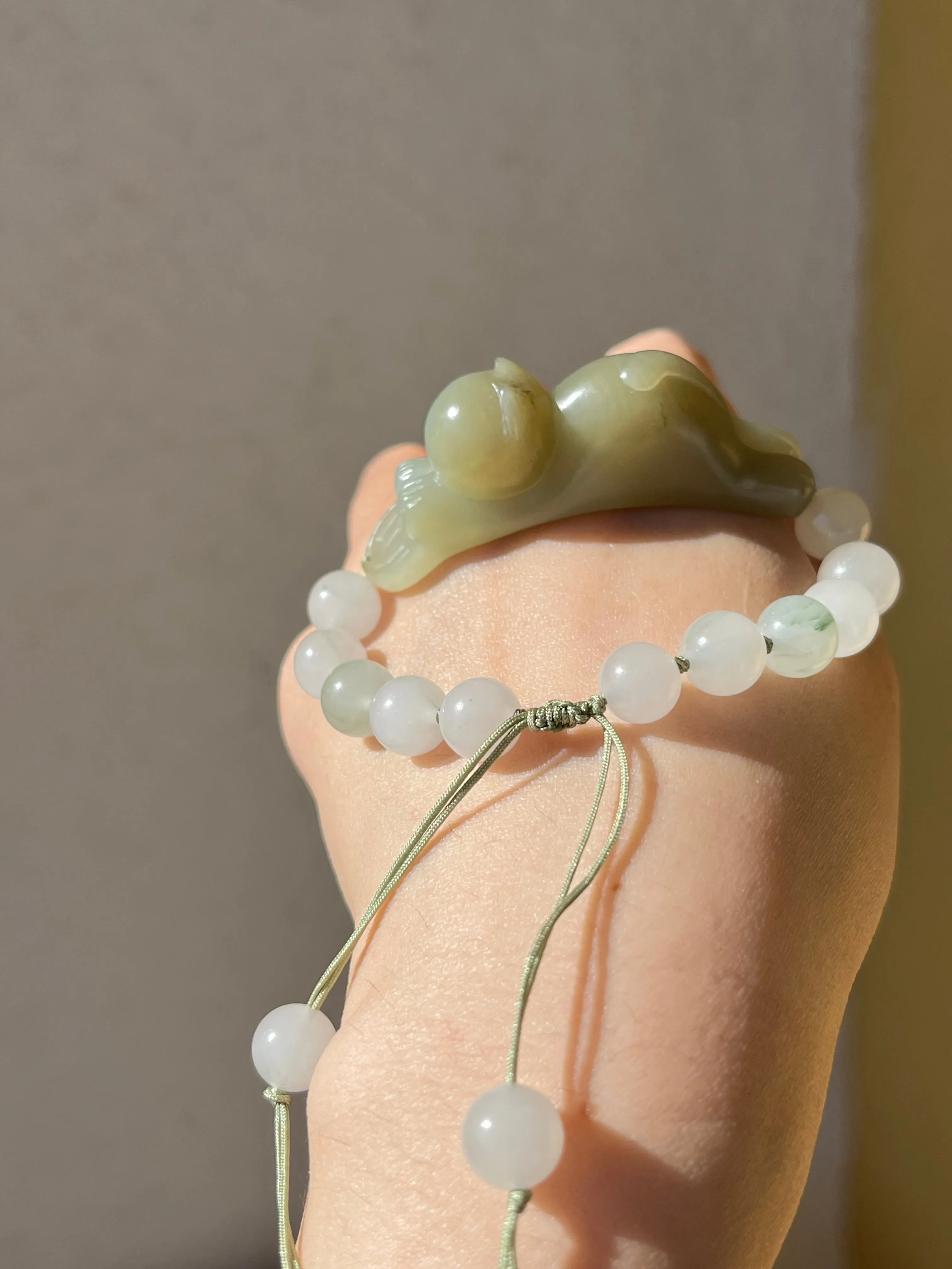 Handwoven Bracelet with a Hand Carved Nephrite Jade Lucky Cat Pendant, 手编和田可爱趴趴招财猫手牌