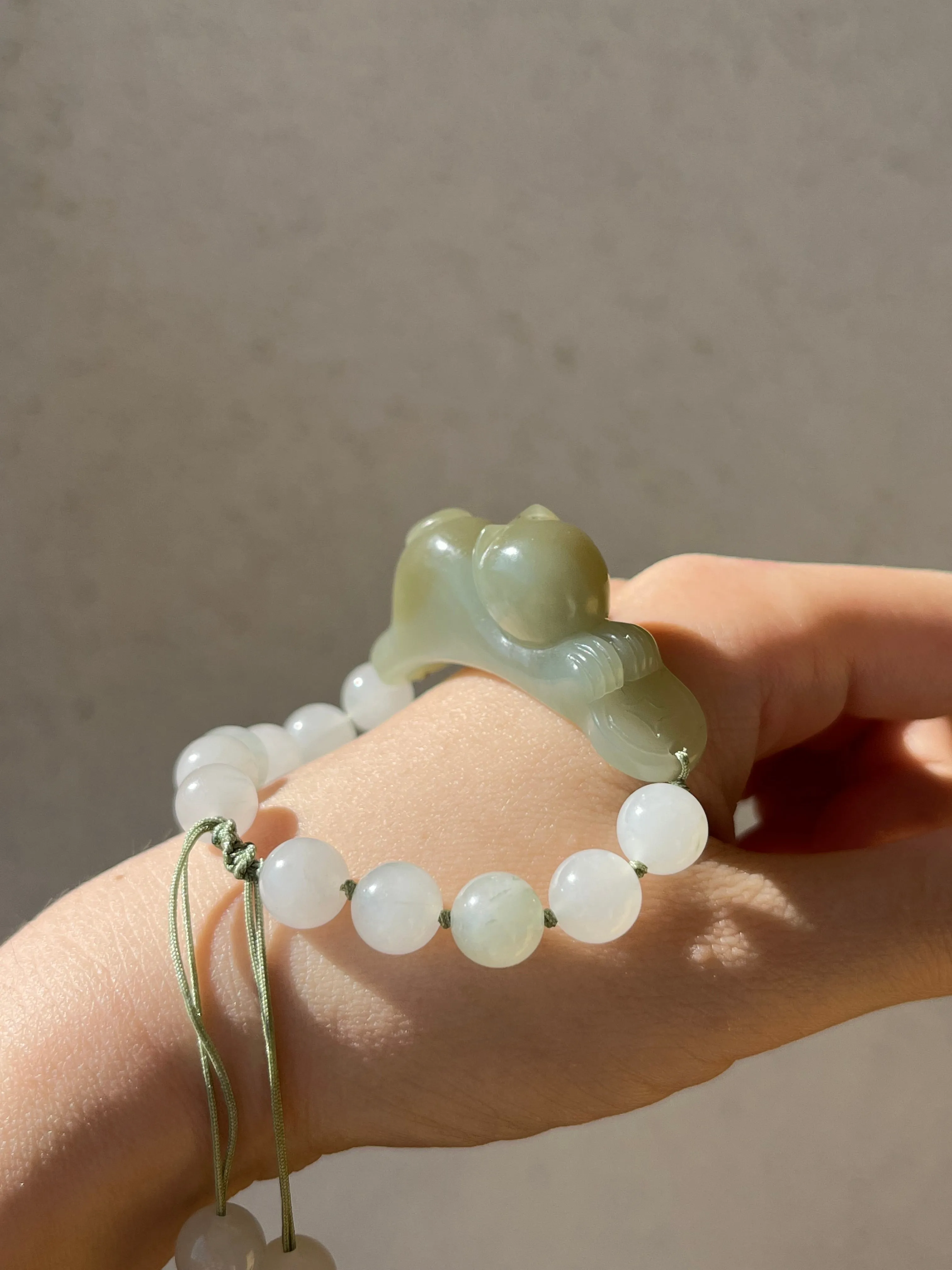 Handwoven Bracelet with a Hand Carved Nephrite Jade Lucky Cat Pendant, 手编和田可爱趴趴招财猫手牌